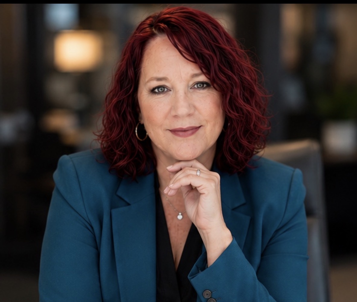 Mariquita Joy — keynote speaker portrait Mariquita Joy The Ladybug in a teal blazer — keynote speaker portrait